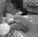hand trimming and finishing of a cast shower tray at the DAYA factory
