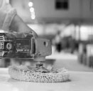 polishing and waxing a stone resin shower tray surface during manufacturing